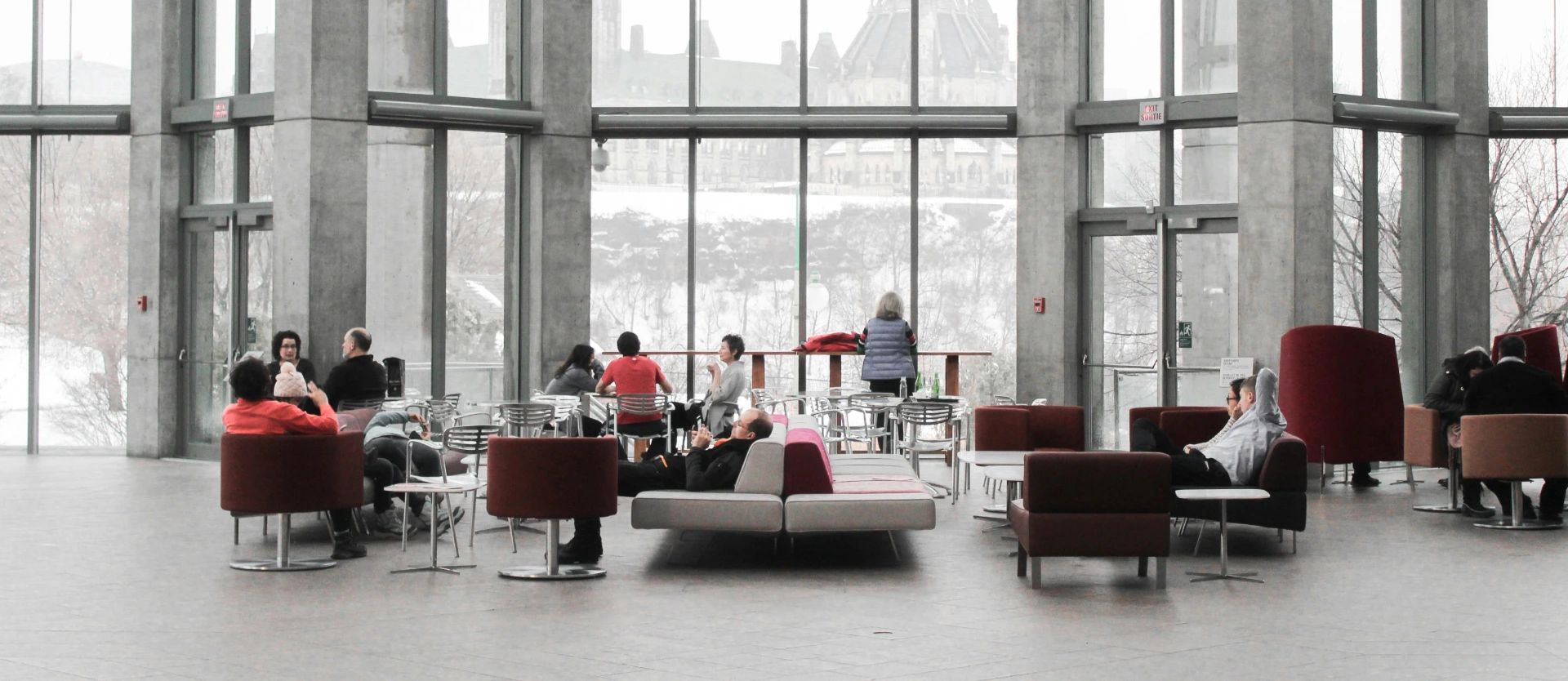 A group of people sitting on top of couches.